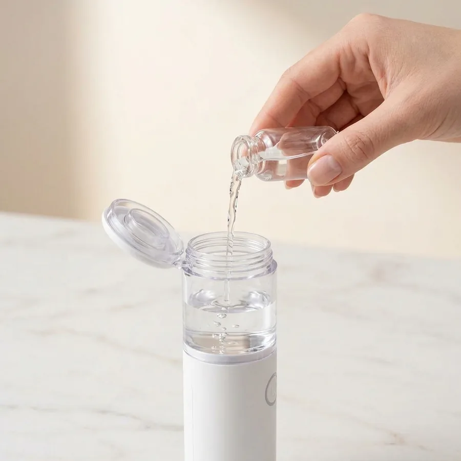 Step 1: Filling the clear medicine cup with saline solution